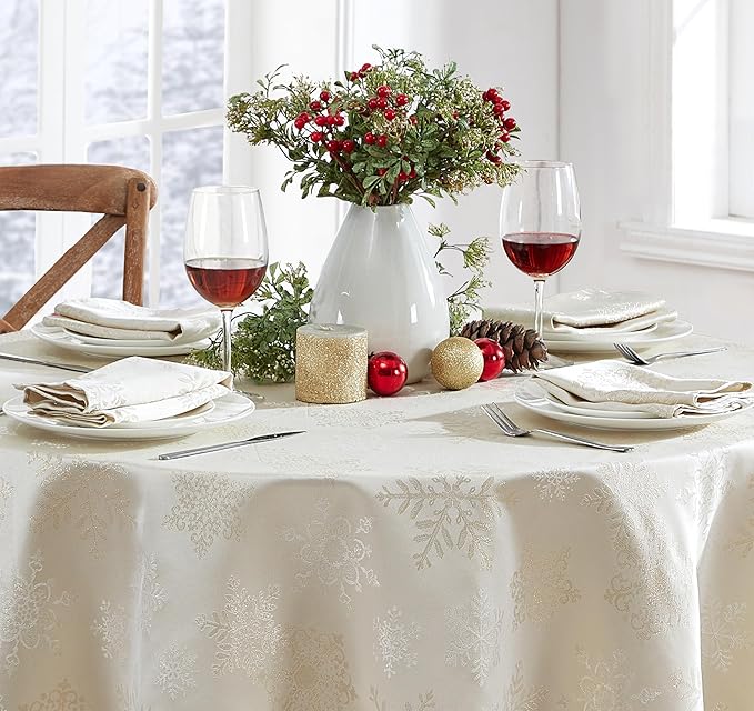 Newbridge Fancy Metallic Snowflake Christmas Fabric Tablecloth, 60 x 84 Inch Oval, Ivory Gold, No-Iron Soil Resistant Sparkling Snowflakes Woven Holiday Table Cover