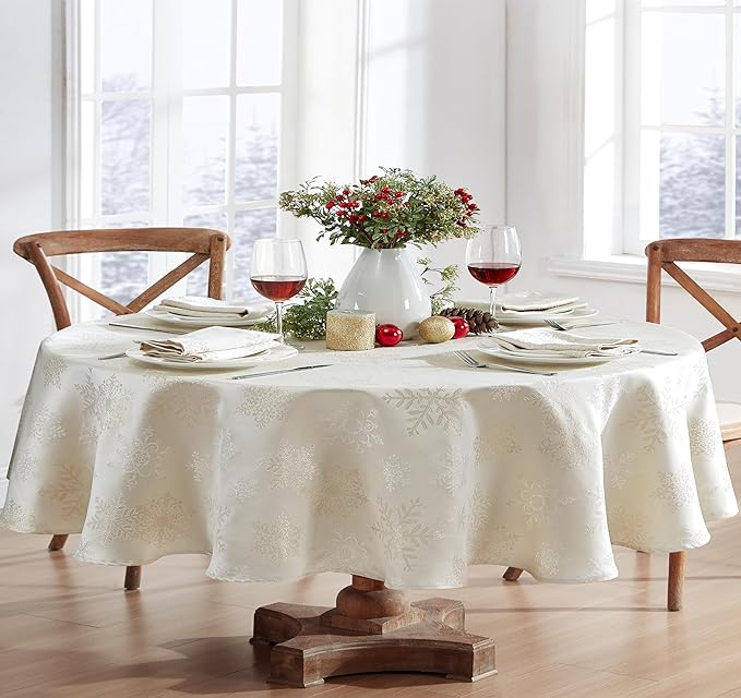Newbridge Fancy Metallic Snowflake Christmas Fabric Tablecloth, 60 x 84 Inch Oval, Ivory Gold, No-Iron Soil Resistant Sparkling Snowflakes Woven Holiday Table Cover