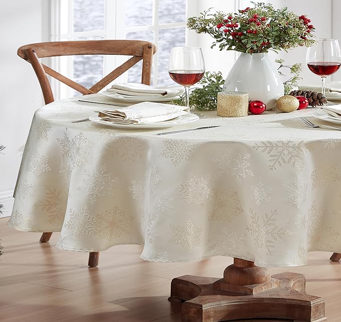 Newbridge Fancy Metallic Snowflake Christmas Fabric Tablecloth, 60 x 84 Inch Oval, Ivory Gold, No-Iron Soil Resistant Sparkling Snowflakes Woven Holiday Table Cover